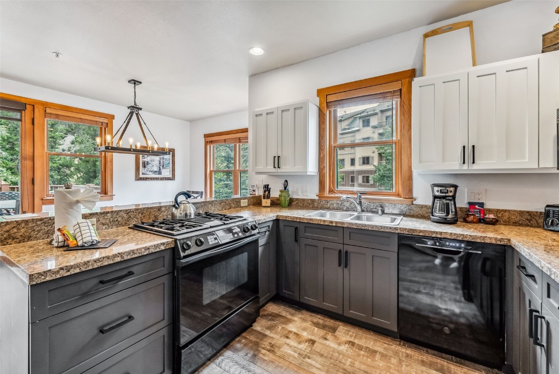 231 Hawk Circle, Unit 2324 Keystone, CO 80435 - Photo 13 of 48 a kitchen with a stove and a sink