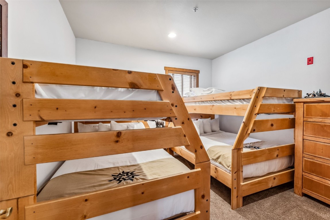 231 Hawk Circle, Unit 2324 Keystone, CO 80435 - Photo 15 of 48 a bedroom with a bed and a dresser