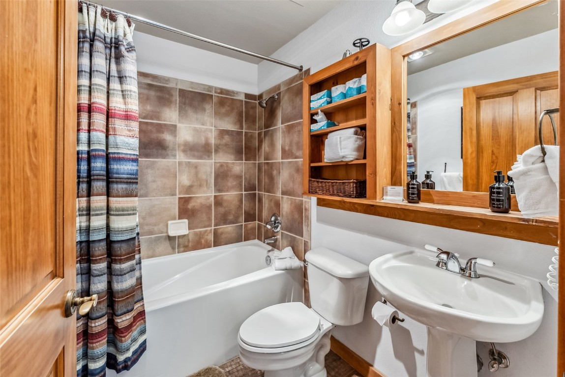 231 Hawk Circle, Unit 2324 Keystone, CO 80435 - Photo 17 of 48 a bathroom with a sink toilet and shower
