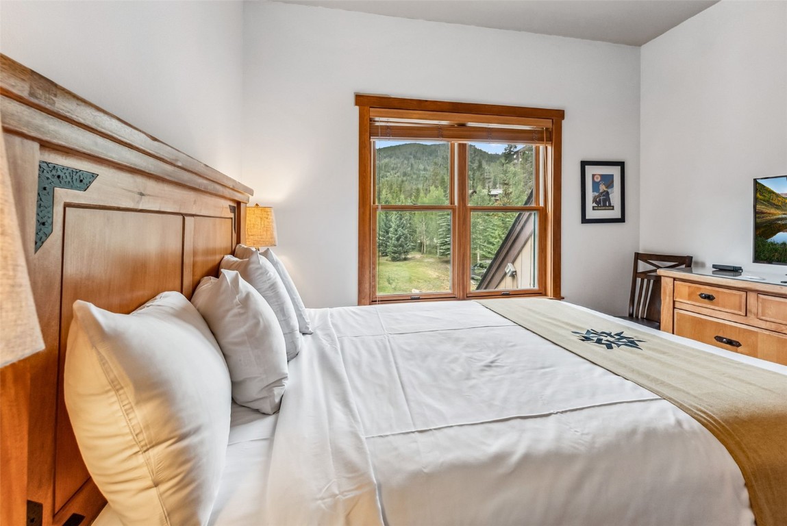231 Hawk Circle, Unit 2324 Keystone, CO 80435 - Photo 22 of 48 a bedroom with a bed and a window