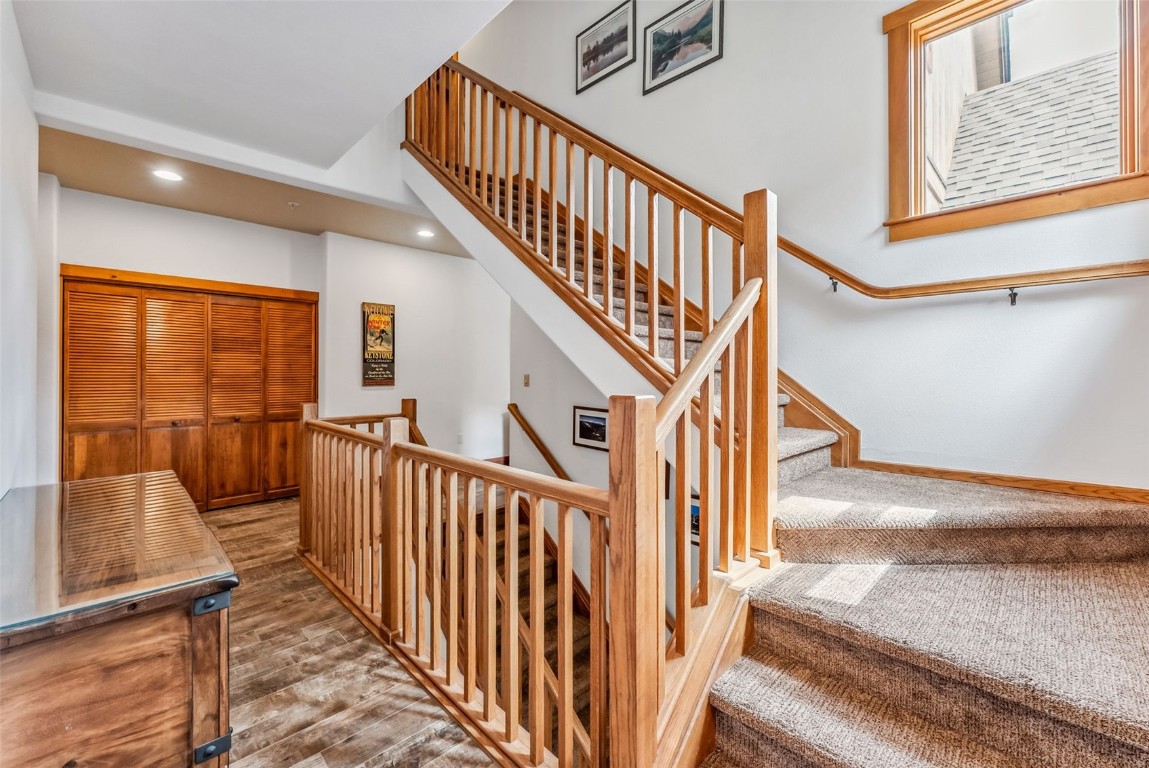 231 Hawk Circle, Unit 2324 Keystone, CO 80435 - Photo 24 of 48 a view of staircase with lots of frames on wall and a window