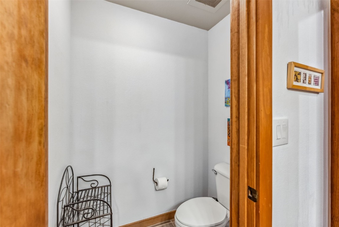 231 Hawk Circle, Unit 2324 Keystone, CO 80435 - Photo 28 of 48 a bathroom with a toilet and a shower curtain