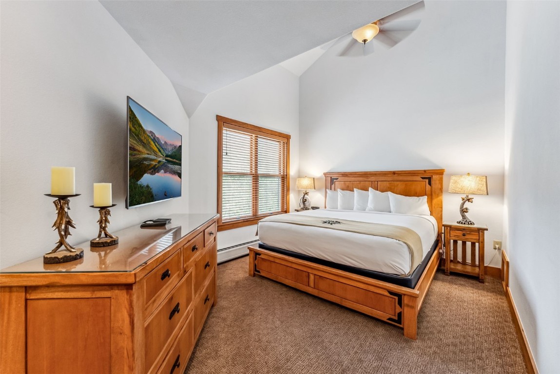 231 Hawk Circle, Unit 2324 Keystone, CO 80435 - Photo 29 of 48 a bedroom with a bed and a flat tv screen on dresser