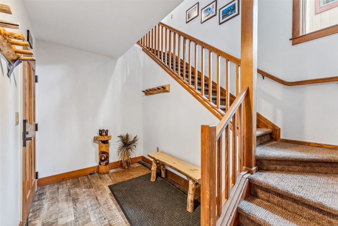 231 Hawk Circle, Unit 2324 Keystone, CO 80435 - Photo 33 of 48 a view of entryway with wooden floor and stairs