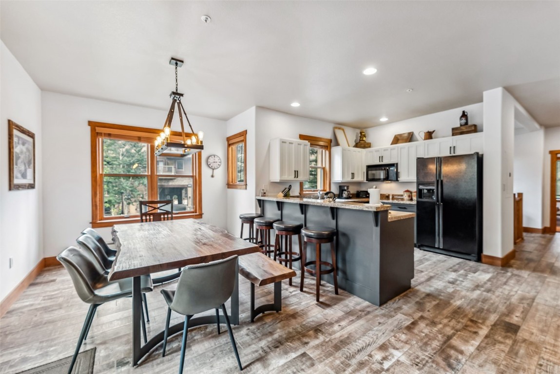 231 Hawk Circle, Unit 2324 Keystone, CO 80435 - Photo 8 of 48 a view of a dining room with furniture window and wooden floor