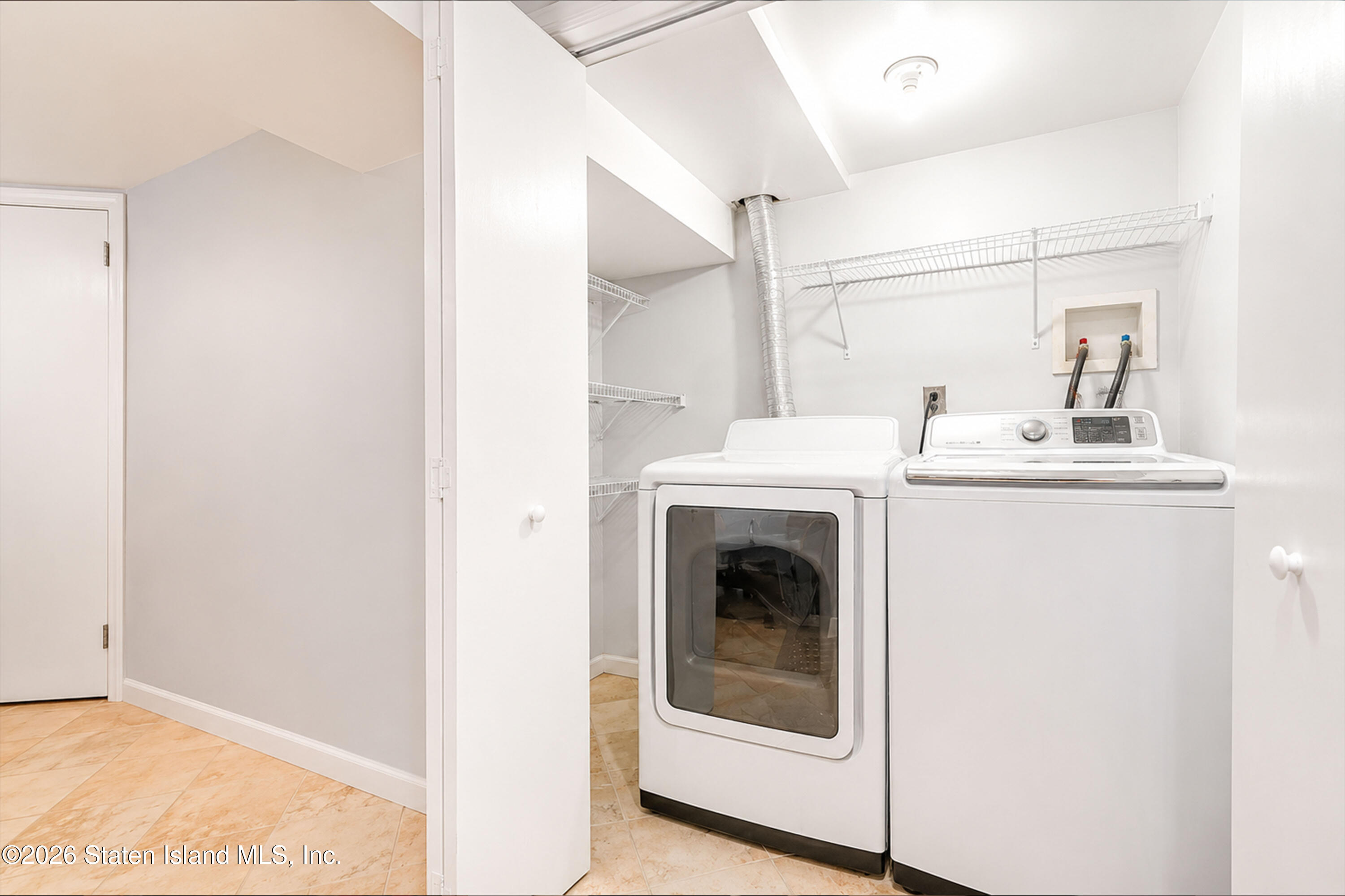 37 Middle Loop Road Staten Island, NY 10308 - Photo 28 of 38 a utility room with dryer and washer