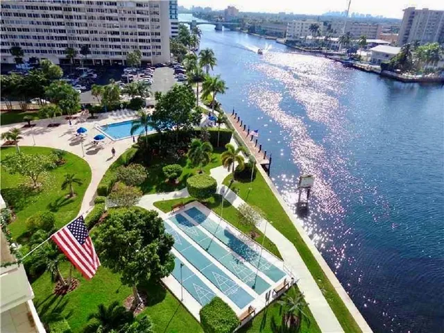 a dining room with furniture and a book shelf