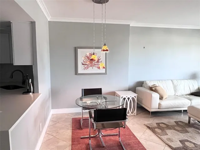 a living room with furniture and a black white walls