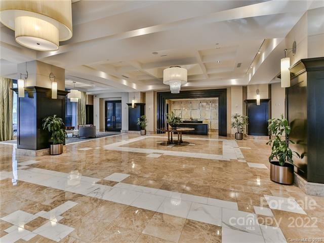 230 South Tryon Street, Unit 1109 Charlotte, NC 28202 - Photo 1 of 17 a view of a lobby with a rug and a potted plant