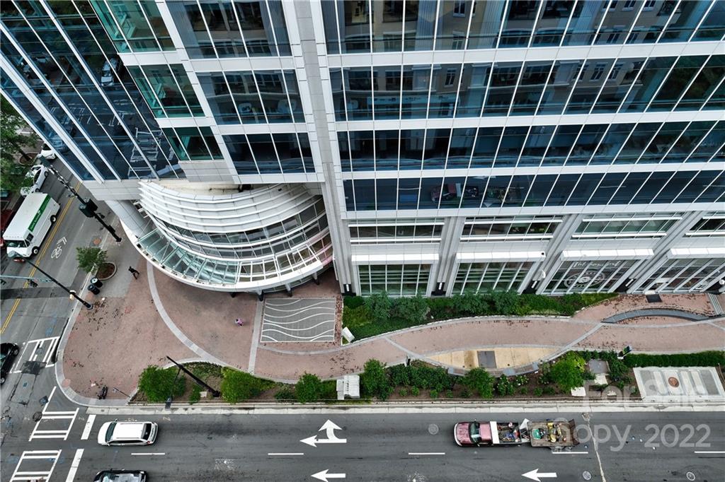 230 South Tryon Street, Unit 1109 Charlotte, NC 28202 - Photo 14 of 17 a front view of a building with glass windows and door