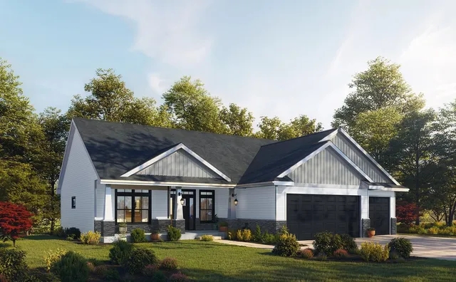 a aerial view of a house with a yard table and chairs