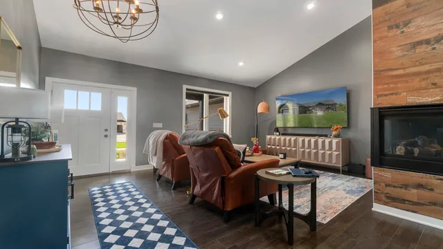 a kitchen with stainless steel appliances granite countertop a sink stove and cabinets