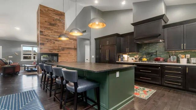 a spacious bathroom with a granite countertop sink a mirror and shower