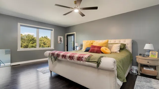 a view of a work space with wooden floor and furniture
