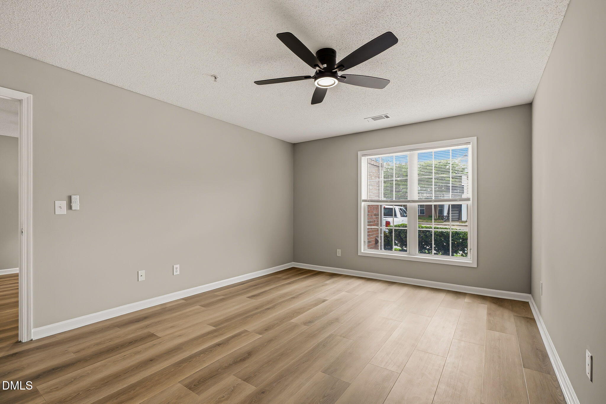 2501 Huntscroft Lane, Unit 100 Raleigh, NC 27617 - Photo 23 of 31 a view of a big room with wooden floor and windows