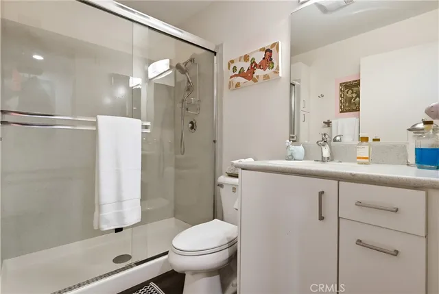 a roof deck with a bench and potted plants