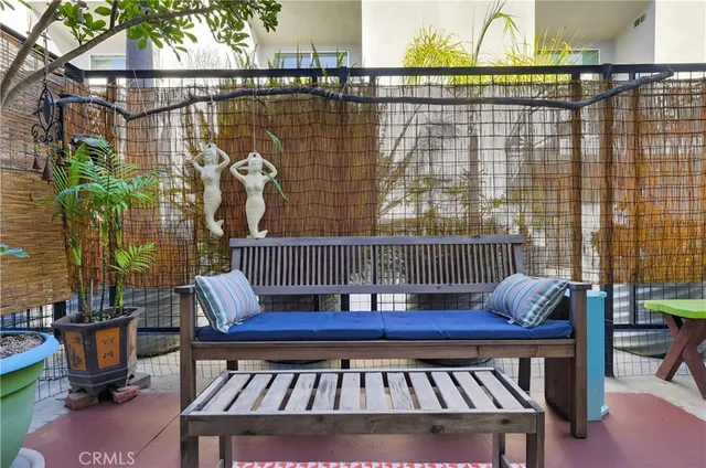 a view of a chairs and table on the balcony
