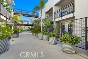 a view of a balcony with wooden floor and city view