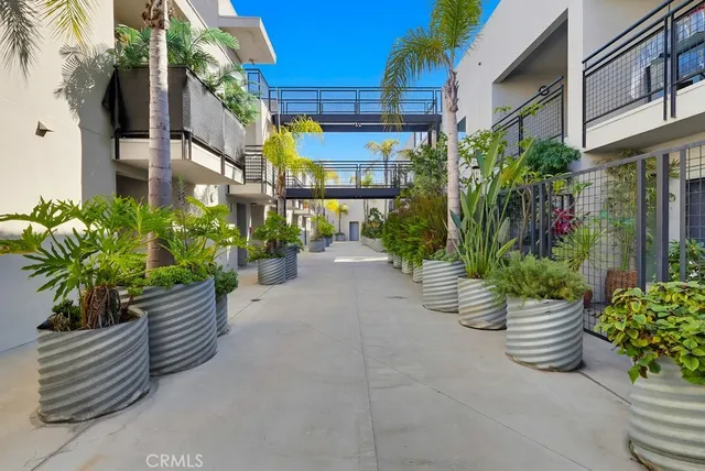 a view of a patio with swimming pool and sitting area