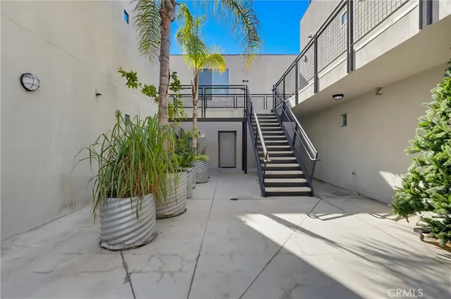 a kitchen with stainless steel appliances granite countertop a sink and cabinets