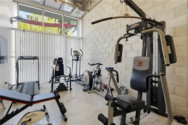 a view of a terrace with furniture and a kitchen