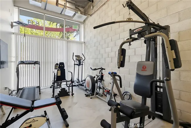 a bedroom with a bed and a table in it