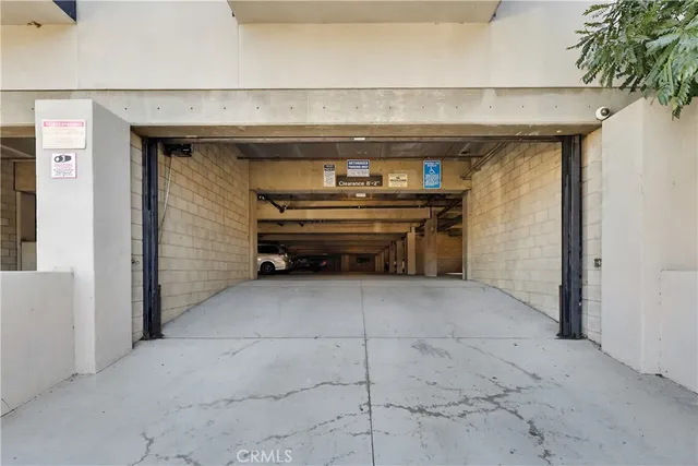 a view of parking garage with cars