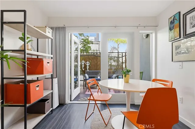 a kitchen with a refrigerator and a stove top oven