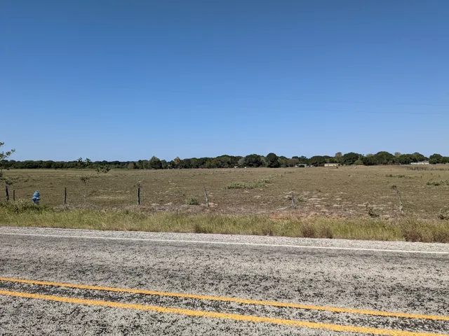 a view of a lake with a yard