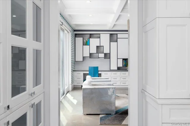 a view of living room with stainless steel appliances granite countertop furniture and a window