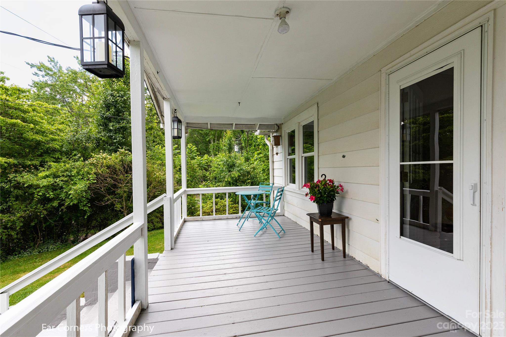 1335 Upper Brush Creek Road Fairview, NC 28730 - Photo 3 of 24 a view of a deck with chairs and wooden floor