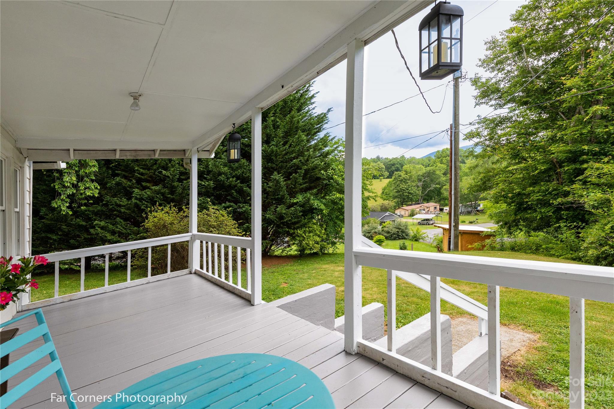 1335 Upper Brush Creek Road Fairview, NC 28730 - Photo 4 of 24 a view of a deck with a floor to ceiling window and wooden floor