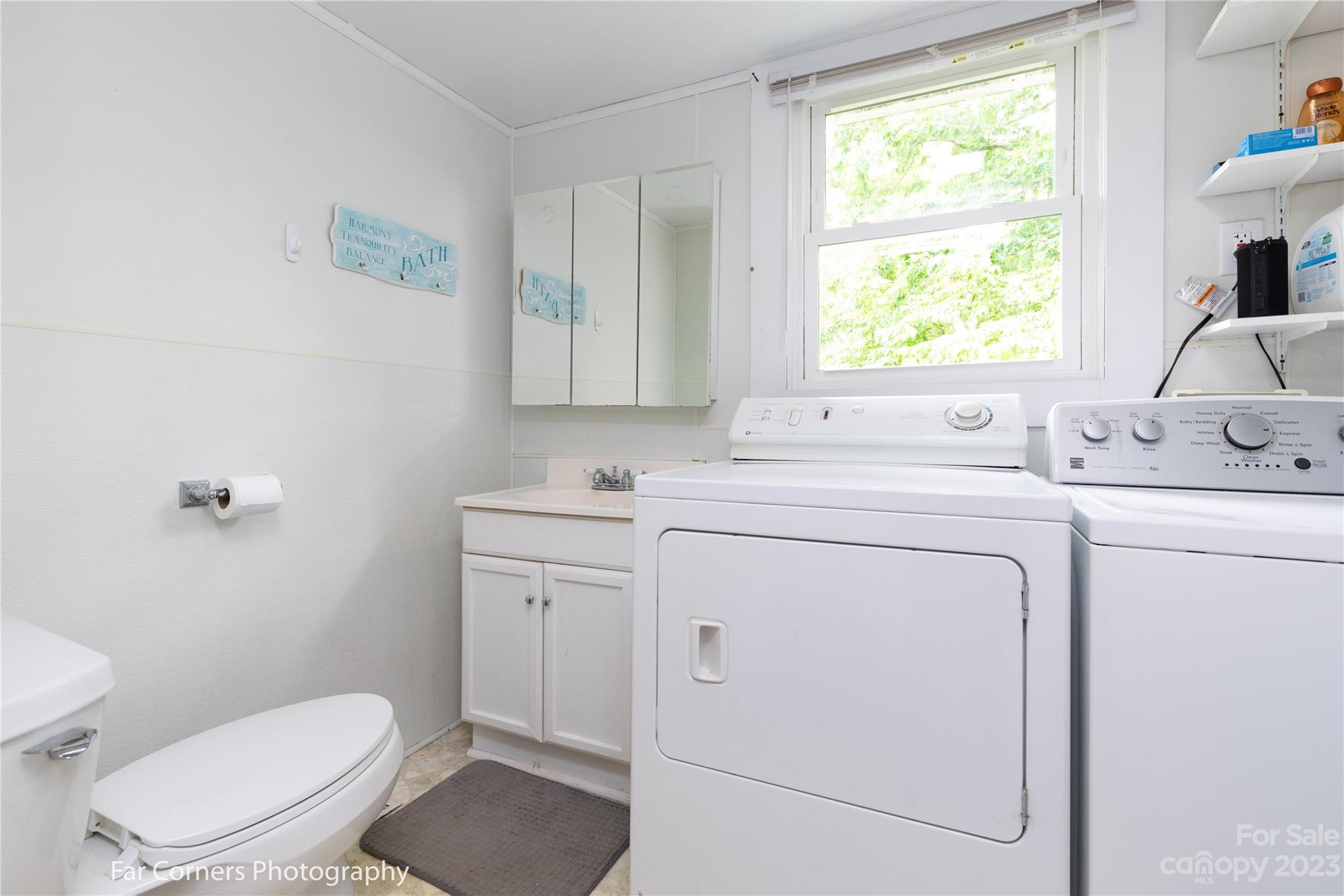 1335 Upper Brush Creek Road Fairview, NC 28730 - Photo 8 of 24 a view of bathroom with a toilet sink and mirror