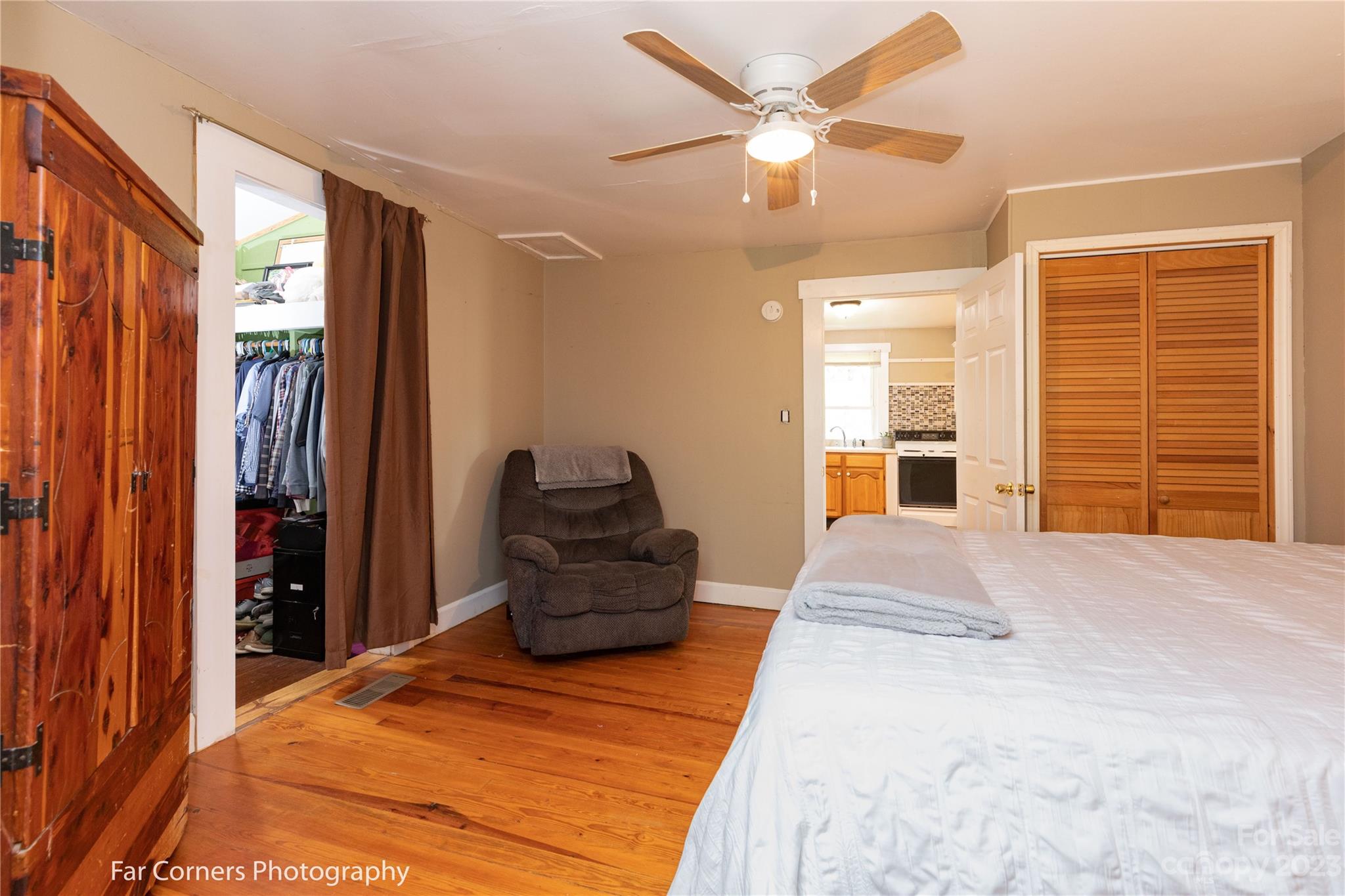1335 Upper Brush Creek Road Fairview, NC 28730 - Photo 10 of 24 a bedroom with a bed dresser and a large window