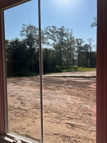 a view of outdoor space and backyard