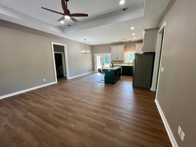 a view of kitchen and refrigerator