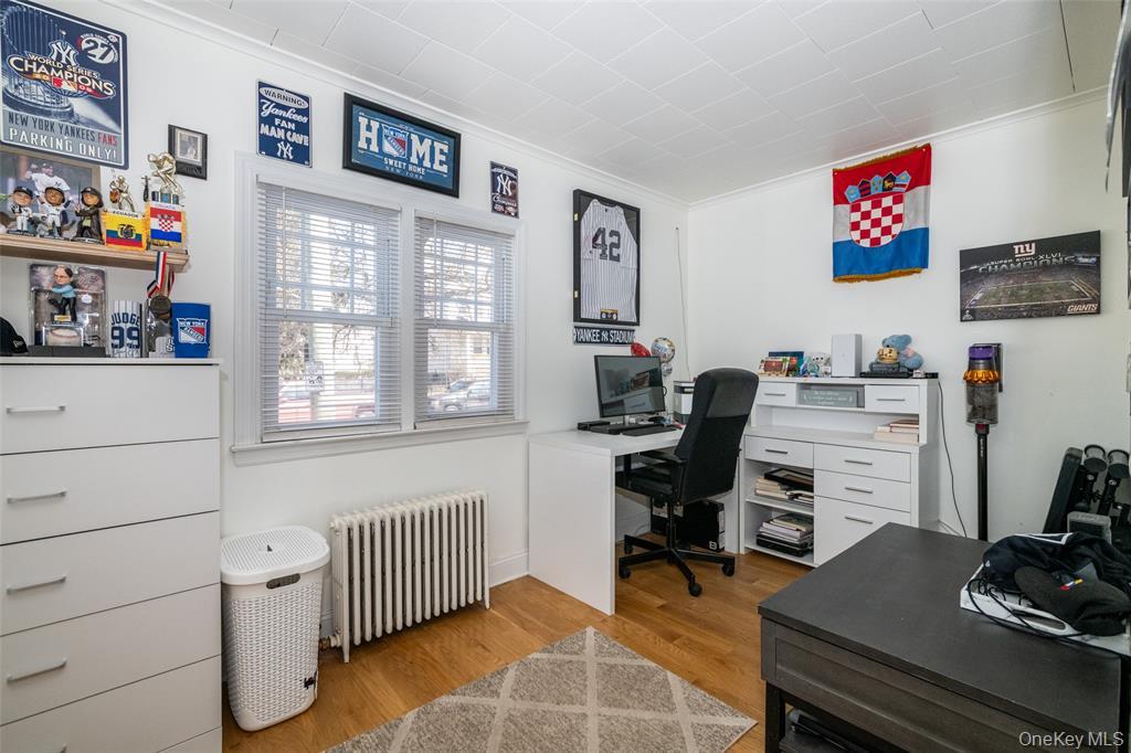 92 Washington Avenue, Unit 1 New Rochelle, NY 10801 - Photo 11 of 22 a view of a workspace with furniture and a window