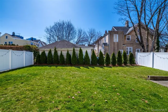 a view of a big yard next to a house