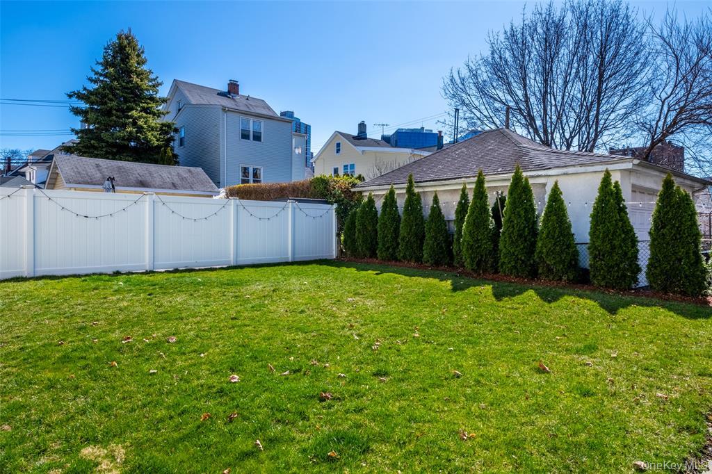 92 Washington Avenue, Unit 1 New Rochelle, NY 10801 - Photo 16 of 22 a view of a house with backyard and garden