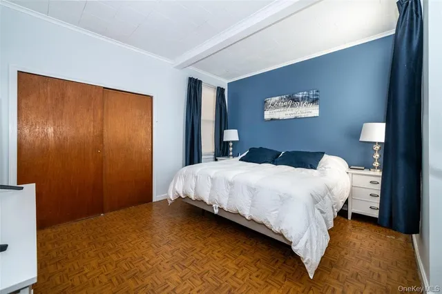 a bedroom with bed and wall painting