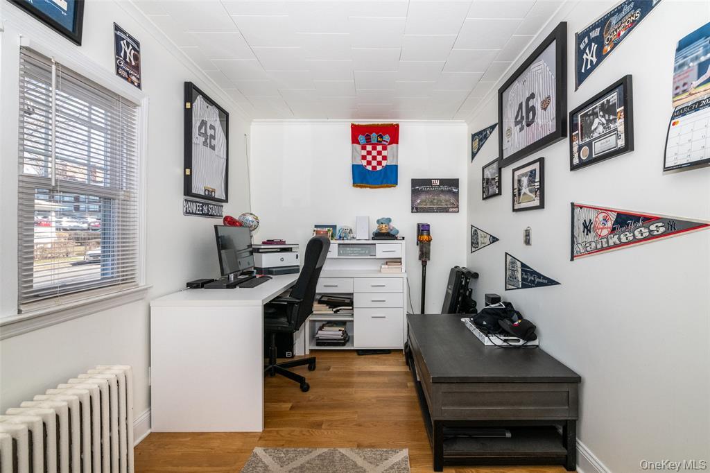 92 Washington Avenue, Unit 1 New Rochelle, NY 10801 - Photo 10 of 22 a view of a workspace with furniture and a window