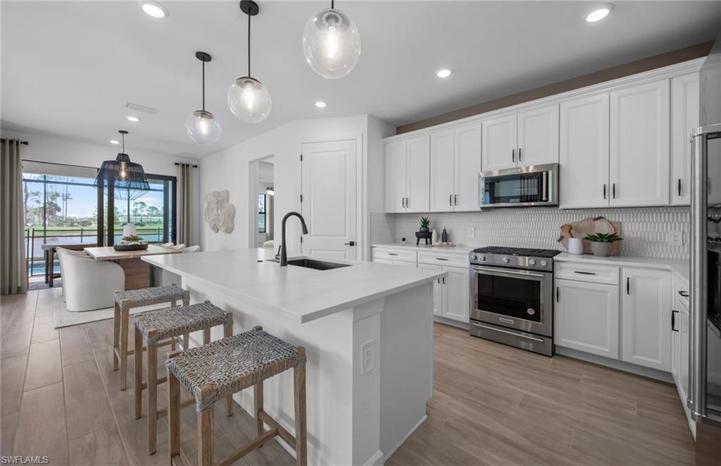 2104 Freemont Way Naples, FL 34120 - Photo 2 of 26 Interior photos are of a staged model home; options may vary.