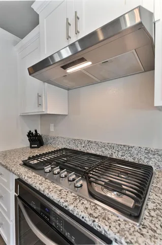 a view of a livingroom with furniture and a fireplace
