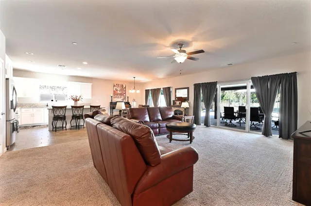 a bedroom with a large bed and a large window