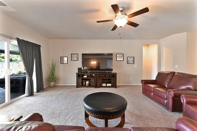 a bedroom with a bed and a television