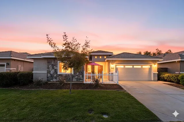 a aerial view of a house with a yard
