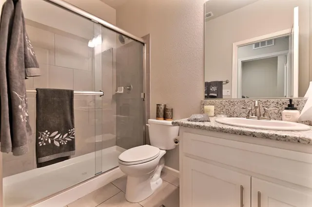 a living room with furniture a bed and a chandelier