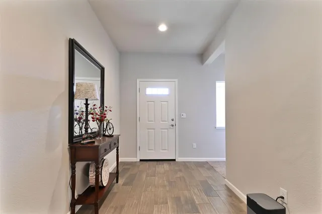 a kitchen with stainless steel appliances granite countertop a stove a microwave and cabinets