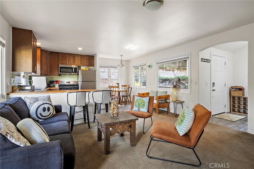 1361 Haddon Drive Cambria, CA 93428 - Photo 7 of 22 a living room with furniture and kitchen view