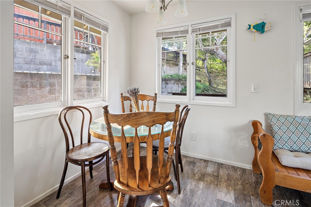1361 Haddon Drive Cambria, CA 93428 - Photo 10 of 22 a view of a dining room with furniture window and wooden floor